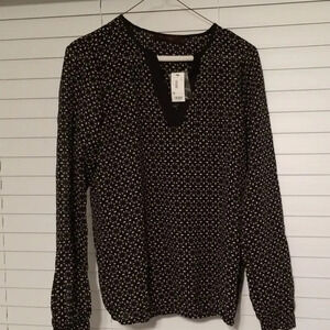 The limited patterned blouse- navy and white size small. Brand new with tags